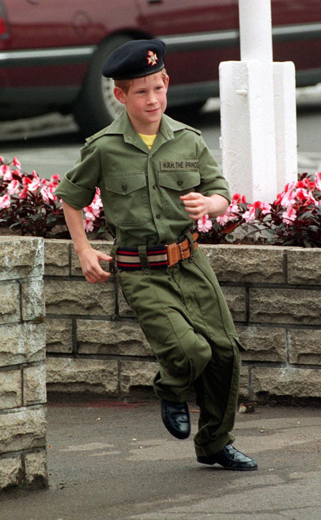 Prince Harry runs towards a light tank during a visit to the barracks of the Light Dragoons in Hannover, Germany July 29, 1993. Picture by Martin Keene, PA 